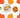 Assorted fall nuts and dried fruits in bowls and a paper bag with pumpkin-themed background